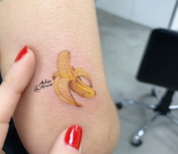 Banana flavored milk tattoo on inner forearm