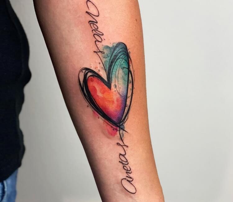 Watercolor style bleeding heart flower tattoo done on