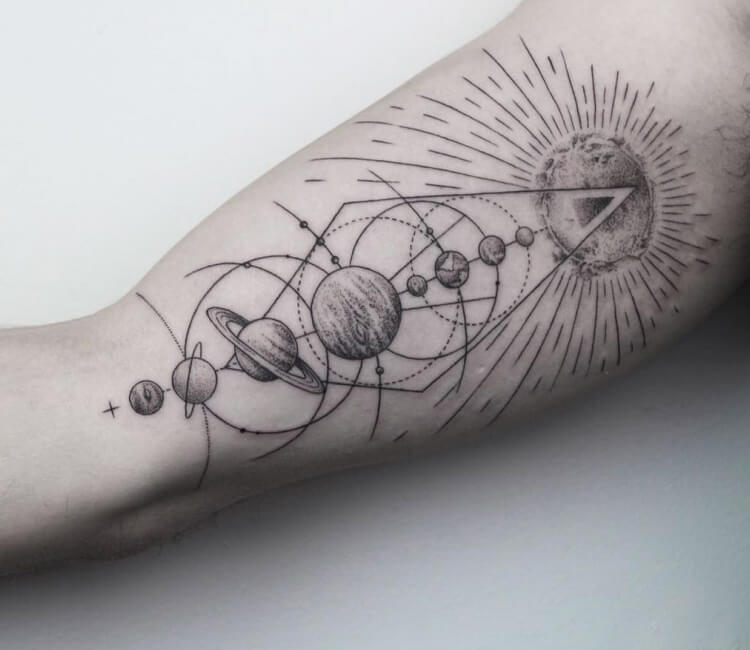 Solar system tattoo on the left thigh.