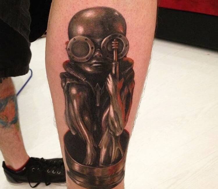 Giger Statue tattoo by Marcos Martins