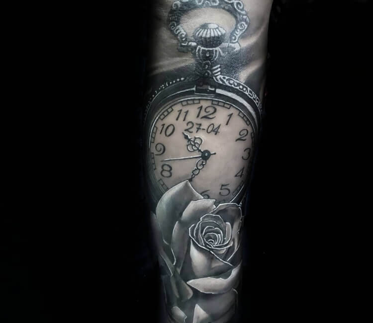 Black and grey pocket watch tattoo on the inner