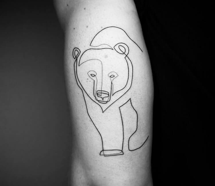 Pooh bear tattooed on the bicep