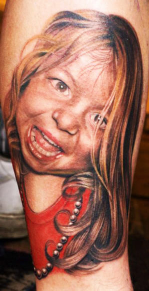 Small Chucky Face Tattoo