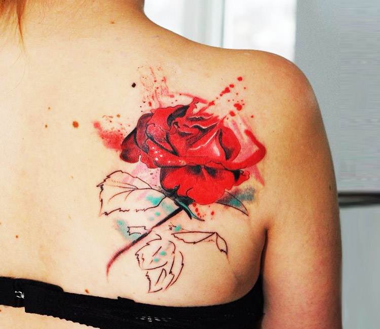 Watercolor red rose tattoo on the bicep