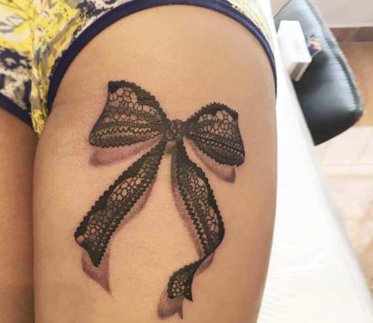 black lace bow tattoo