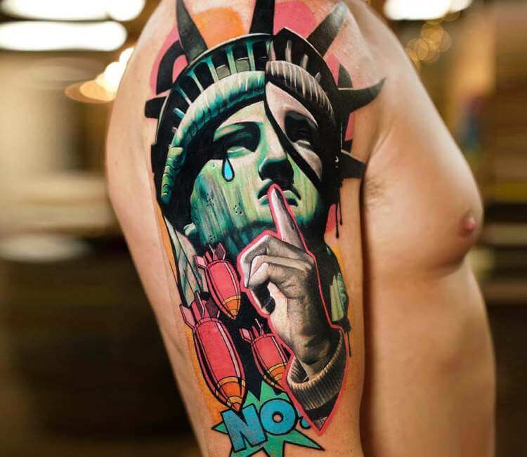 Statue of liberty tattoo on the left forearm
