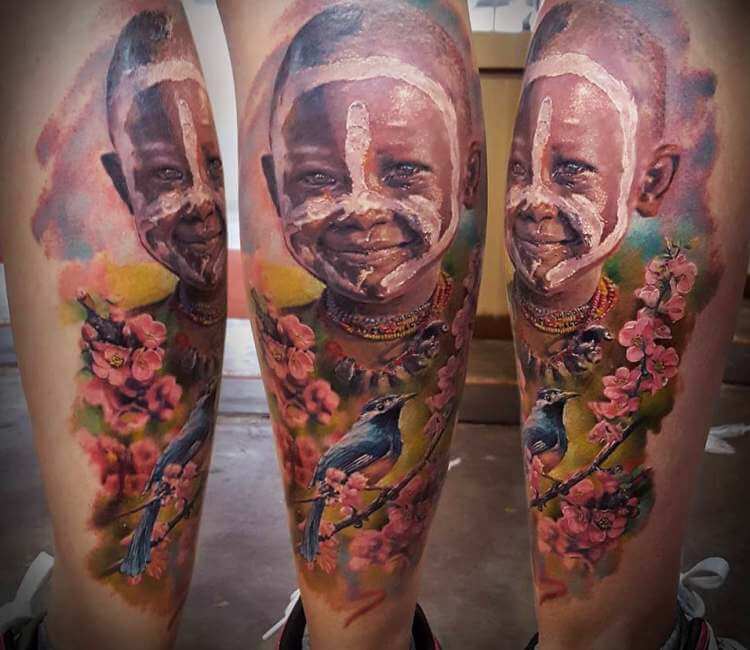 Aboriginal child tattoo by El Mago Tattoo
