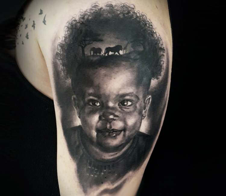 African Child tattoo by El Mago Tattoo