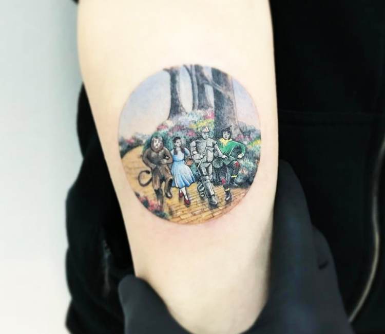 The Wizard of Oz Miniature Tattoo on Girls Upper Arm