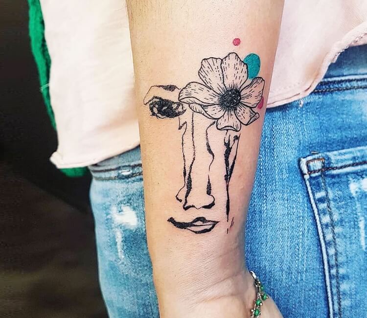 Single needle flower head woman tattoo on the inner