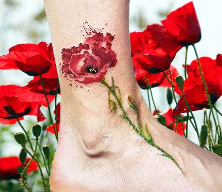 Poppy flower tattoo located on the bicep, fine line