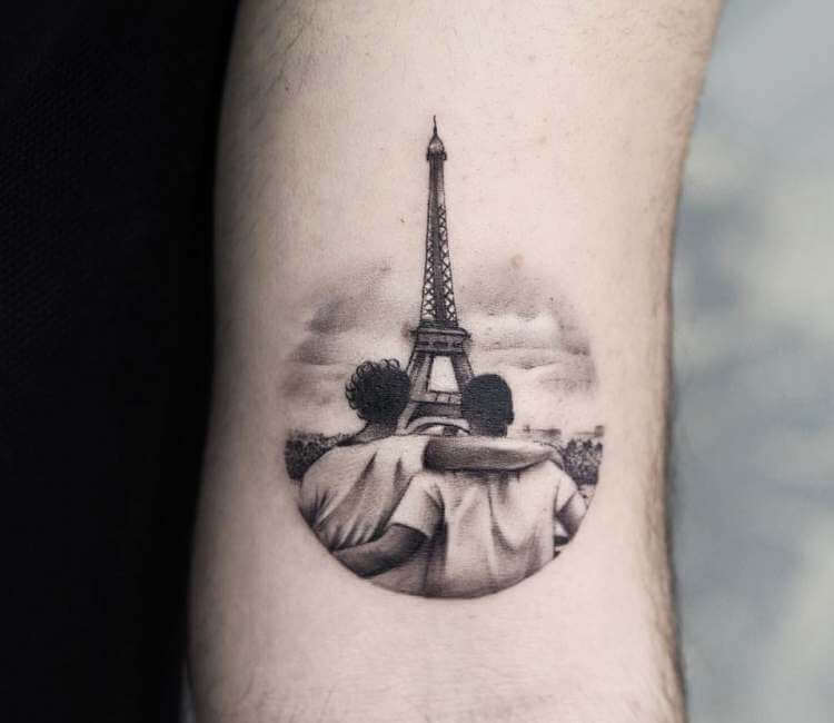 Eiffel tower tattoo on the right forearm