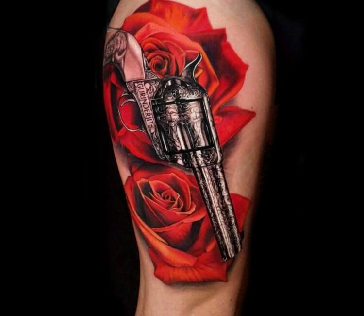 Guns and rose flowers drawn in tattoo style Vector Image