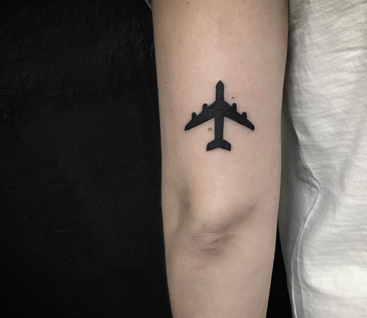 Micro airplane tattoo on the arm - Tattoogrid.net
