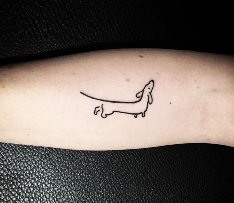 Dachshund tattoo by Kafka Tattoo