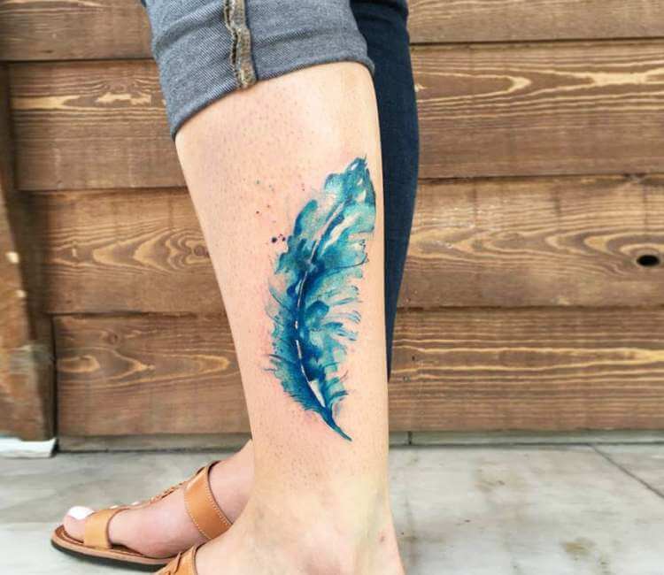 Peacock feather tattoo on leg on black background Desktop wallpapers  1024x600