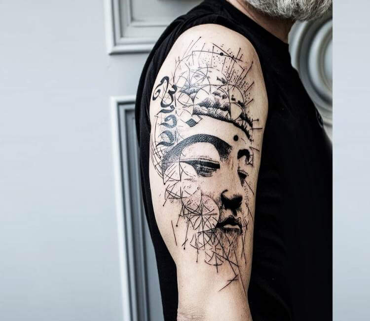 The eyes of the Buddha tattoo on the right forearm.
