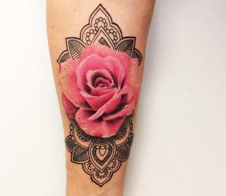 Pink rose tattoo on the upper back.