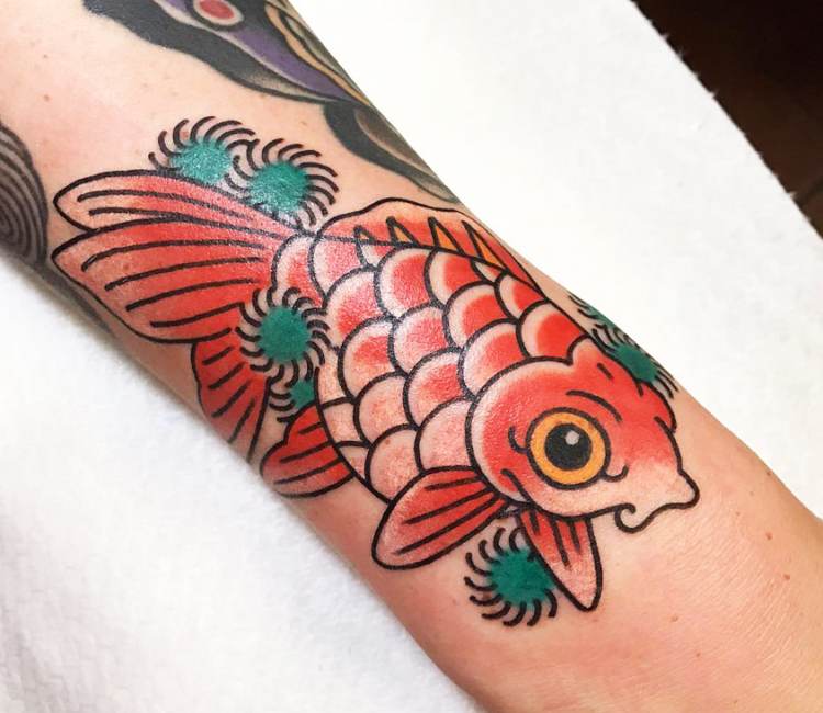 Traditional style fish tattoo on the shin