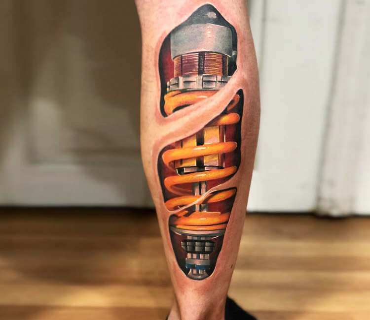 Another day, another shock absorber tattoo. This one full colour. Under 2  hours work. | By South Coast Ink - Facebook