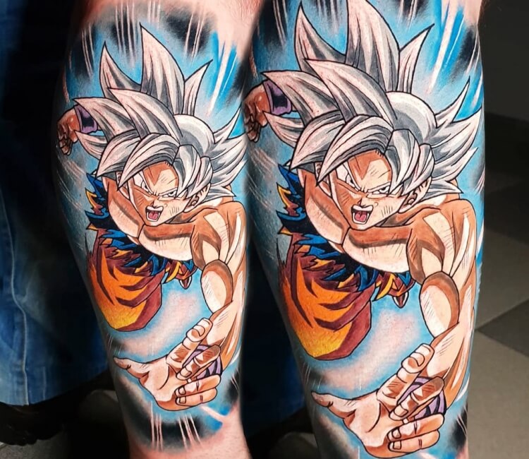 Goku tattoo located on the calf cartoon style