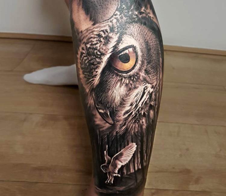 Experience the wise allure of an owl adorned with glasses in this  captivating leg tattoo, merging realism with a hint of charm. | Instagram