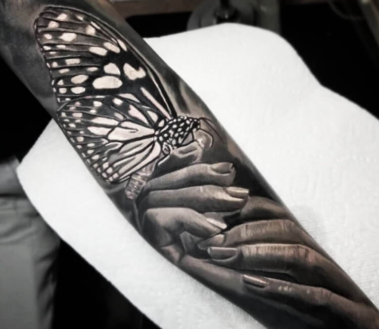 Simple black and grey butterfly tattoo on the left upper arm   Tattoogridnet