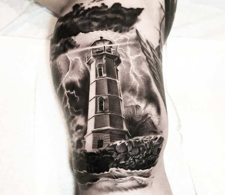 Black and grey realistic tattoo style of Lighthouse motive done by artist M...