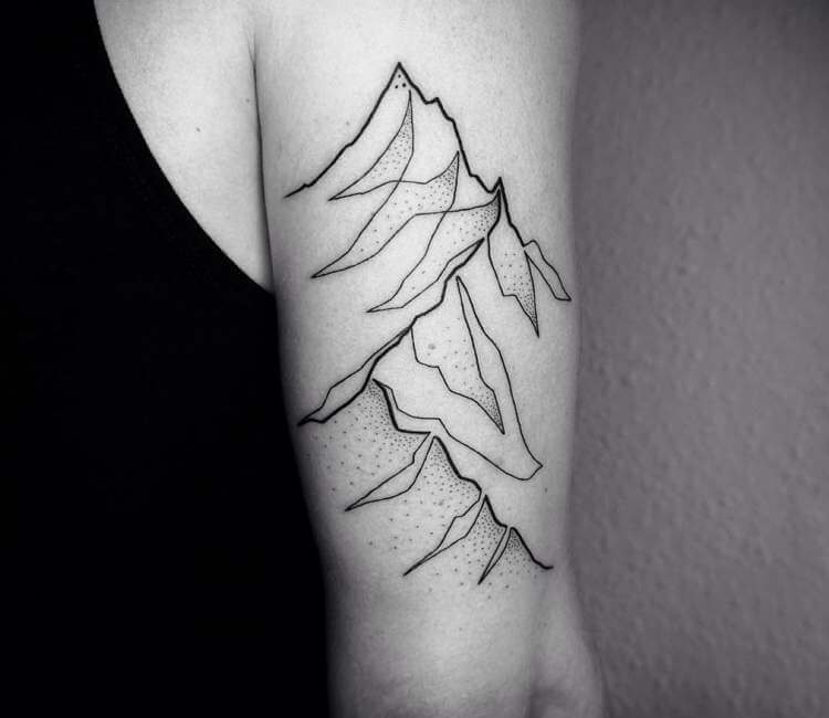 Premium Photo | A black and white photo of a mountain tattoo on the arm  generative ai