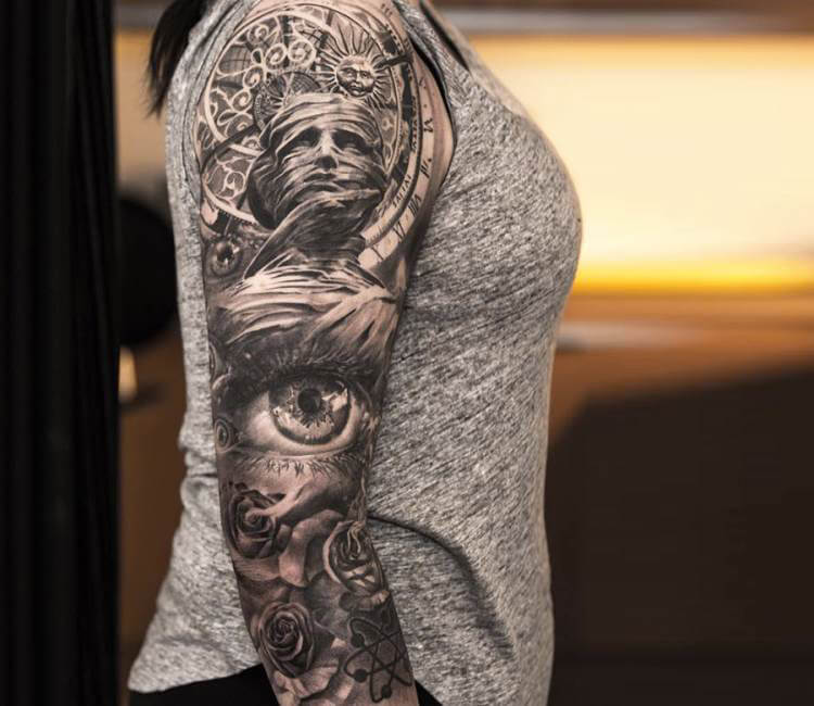 Black and Grey sleeve tattoo by Niki Norberg