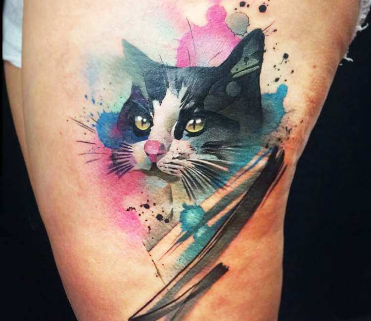Black cat tattoo located on the upper arm watercolor