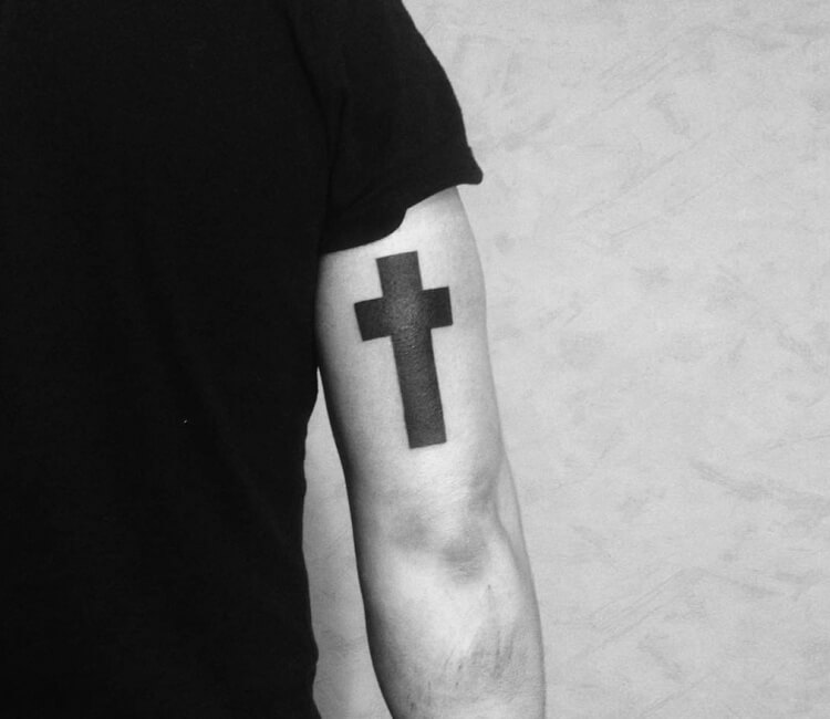 Black cross tattoo by Evgeny Pavlikov