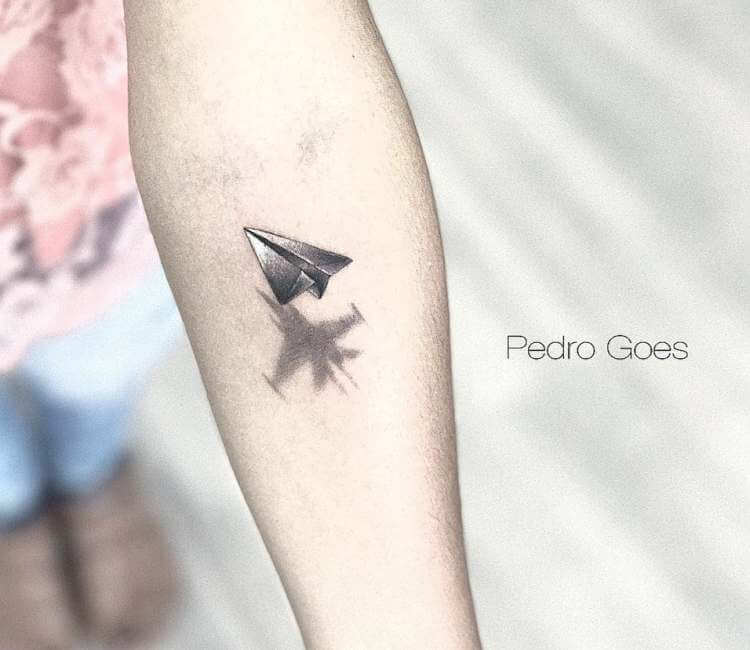 Paper plane tattoo by Pedro Goes