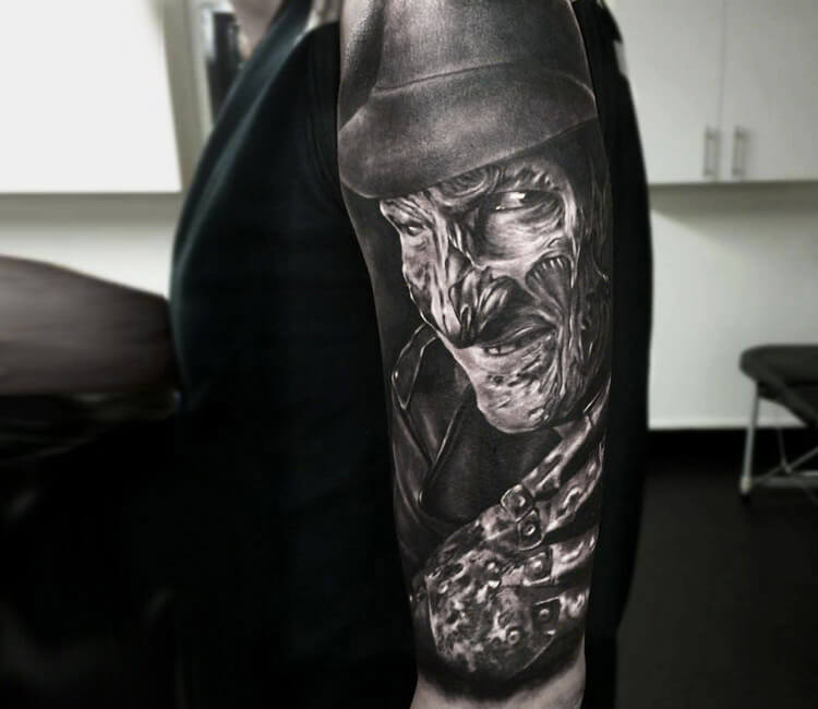 Small Grey Freddy Krueger Tattoo On Arm Sleeve