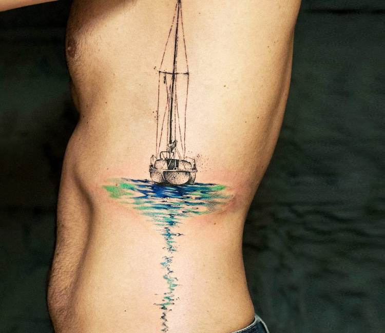 Paper boat tattoo on the achilles.