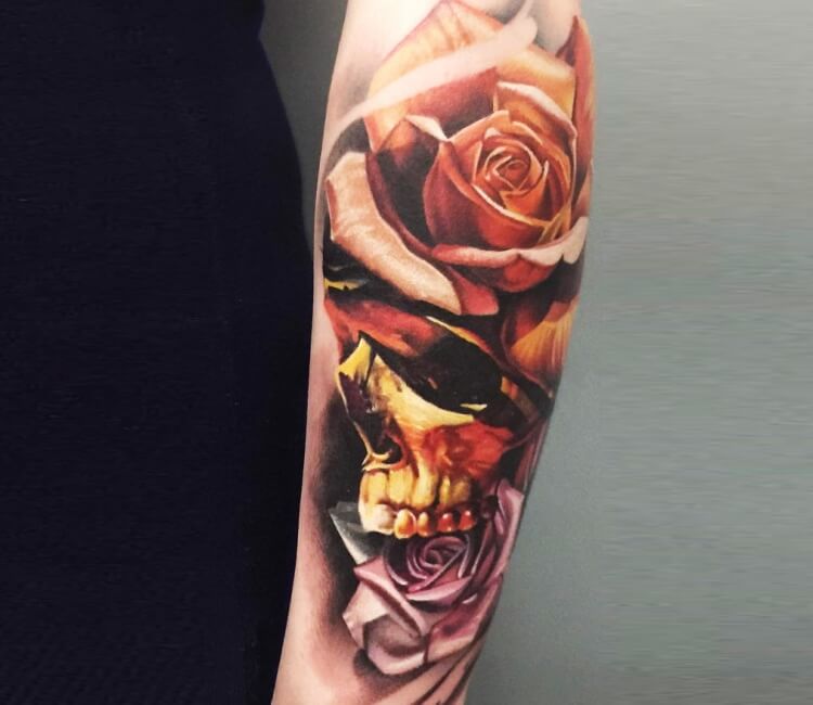 Forearm sugar skull tattoo with roses and birds