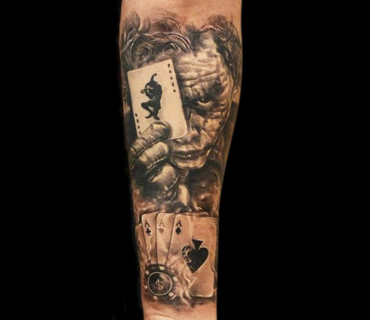 Microrealistic The Joker portrait tattoo on the inner
