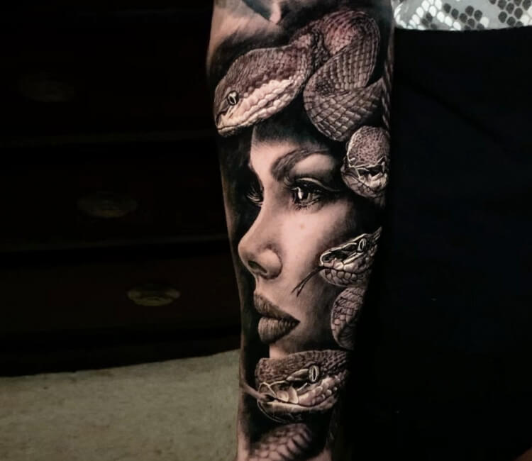 Realistic Medusa portrait tattoo on the thigh