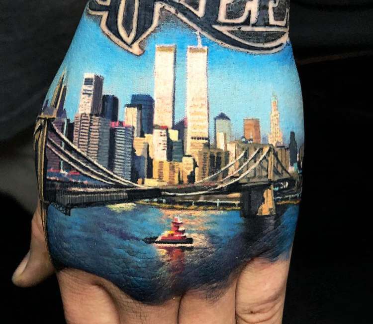 Fine line NYC skyline tattoo on the inner forearm